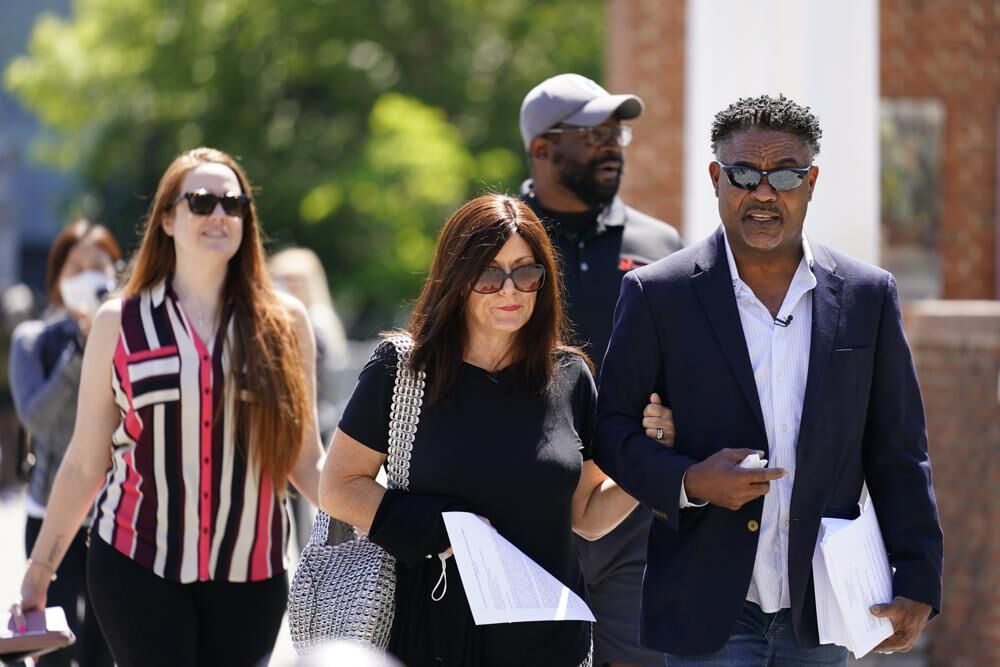 Players with their wives walking.jpeg